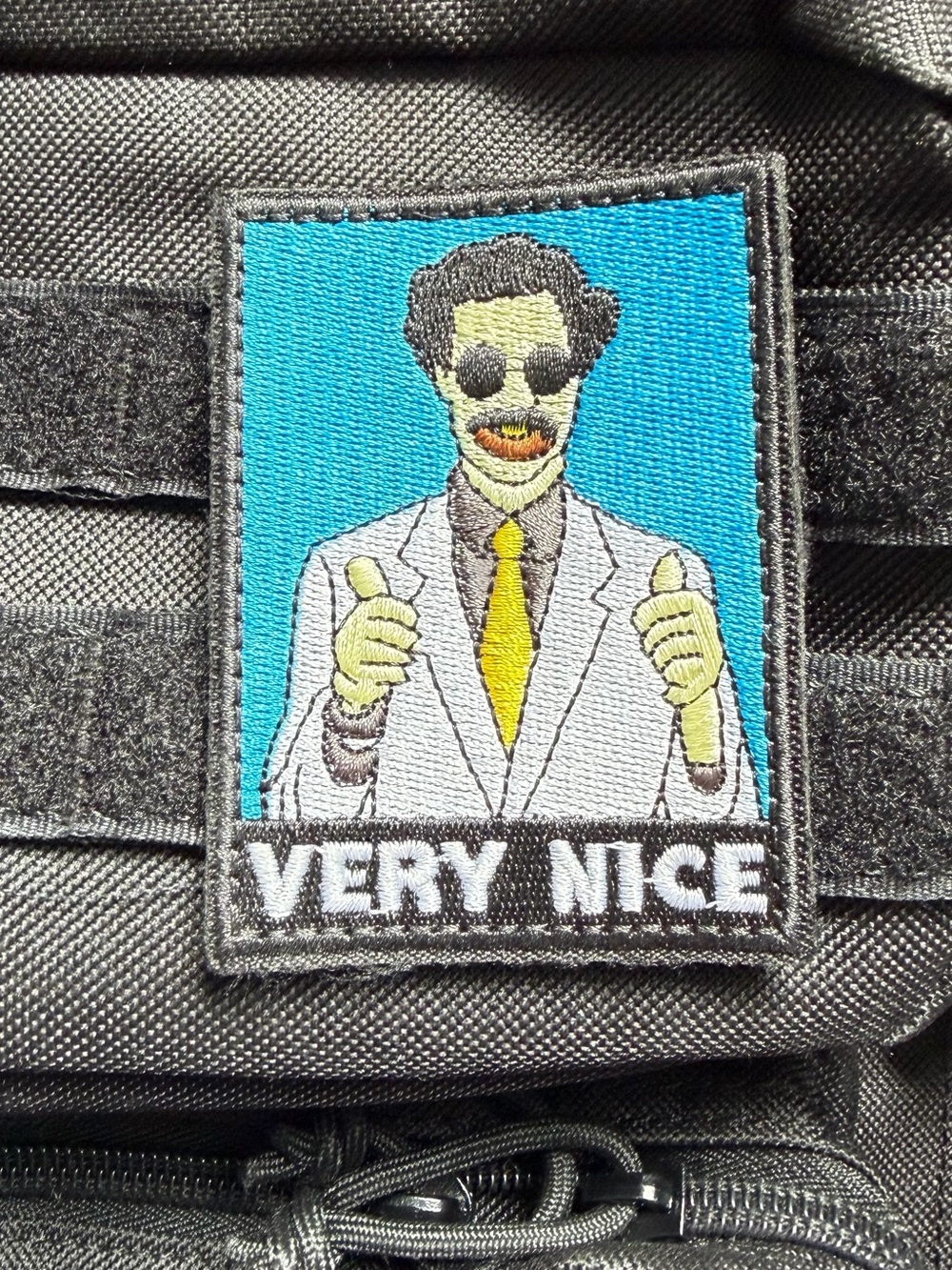 Borat 'Very Nice' Embroidered Patch - Bright Teal Background